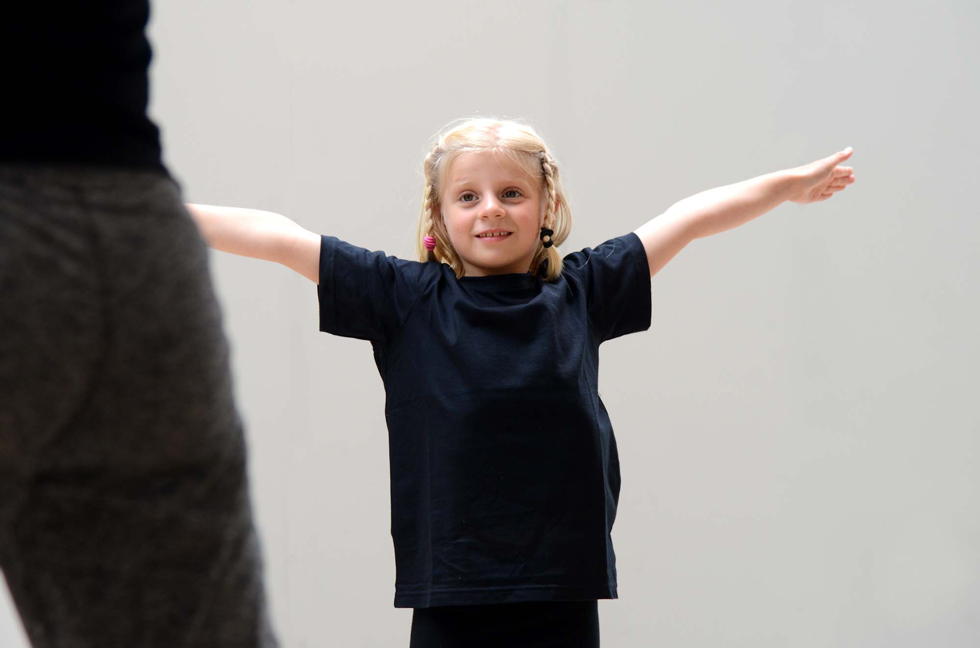 Small class of children enjoying creative dance session