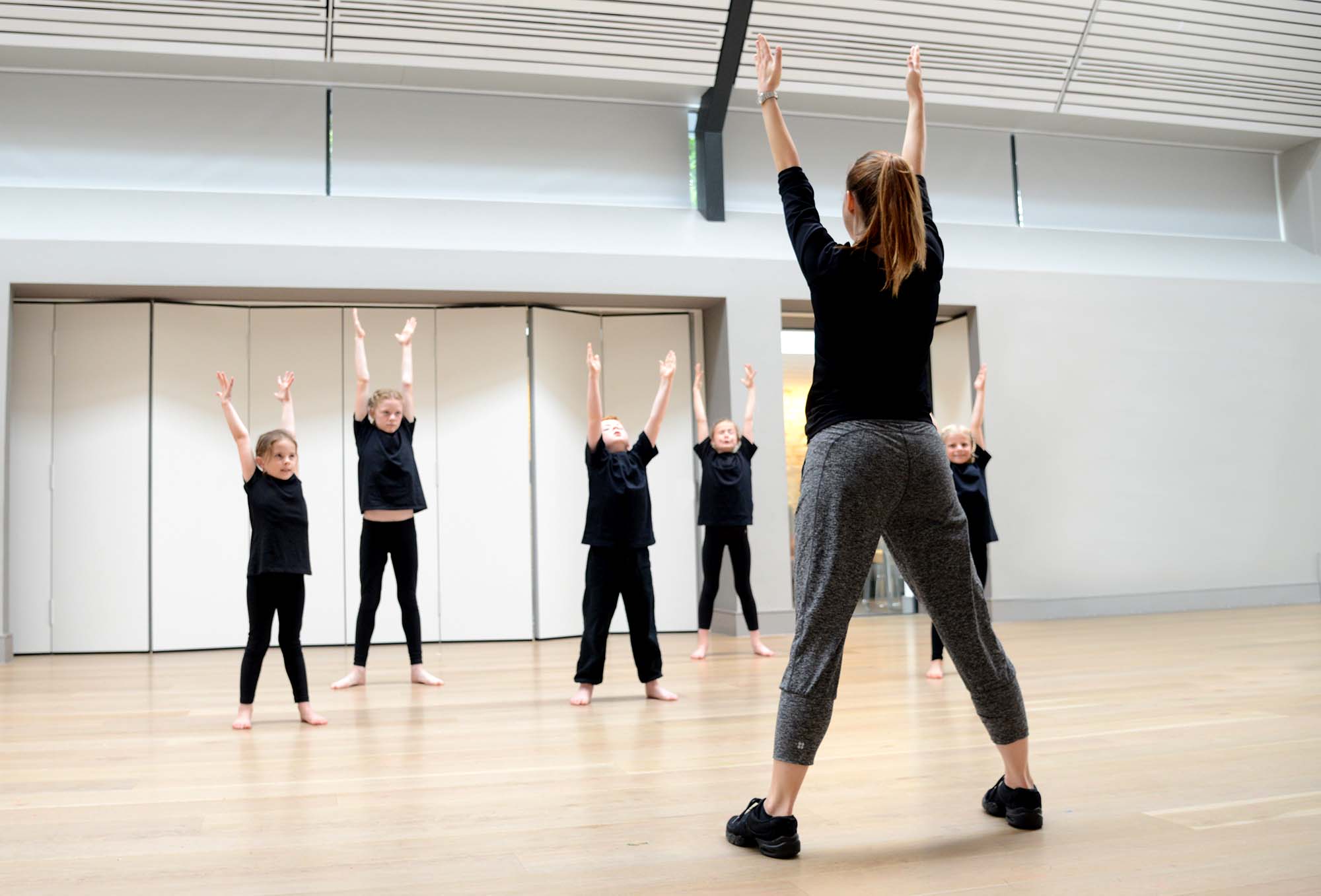 Boys and girls warming up together in a street dance class at Intune Dance