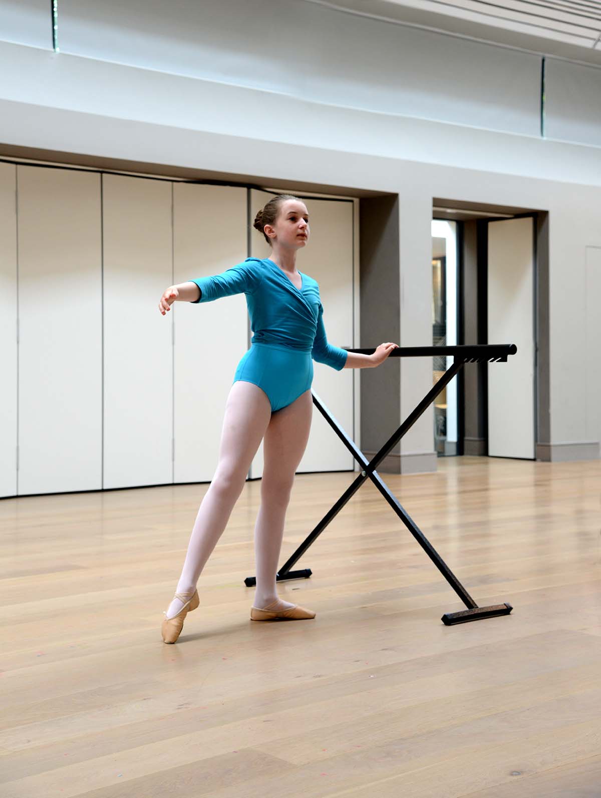 Children practising travelling steps in a dance class at Intune Dance